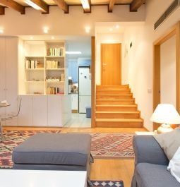 Spacious living room with wooden ceilings