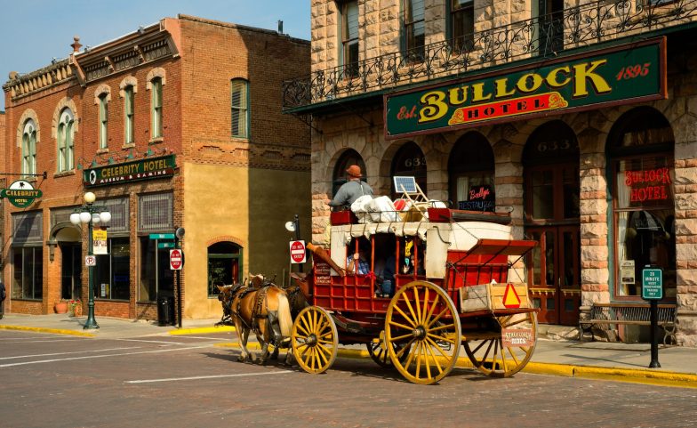 Stagecoach in front of the haunted Bullock Hotel in Deadwood, SD