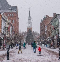 snow falling in charming town