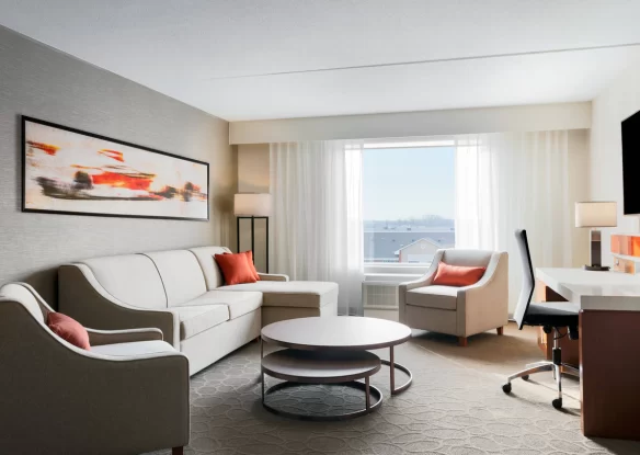 A suite with a sofa at an airport hotel