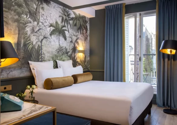 Interior of a hotel room with a street view