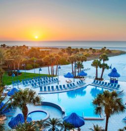 Outdoor pool view at sunset