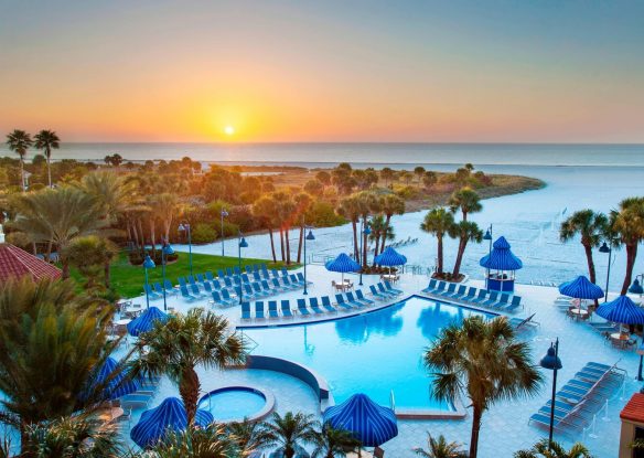 Outdoor pool view at sunset
