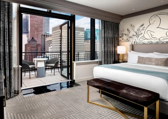 guest room at luxury Chicago hotel with outdoor patio