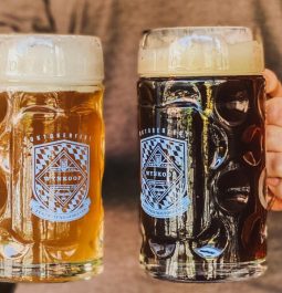 two beers in hand at Wynkoop Brewing Company
