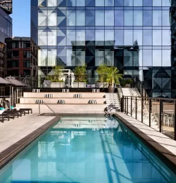 Rooftop terrace with a pool among skyscrapers